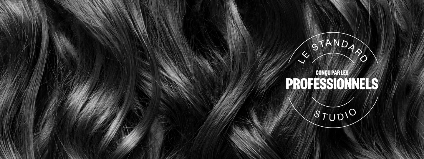 Professional studio standard seal reading 'designed by professionals' over flowing hair texture background
